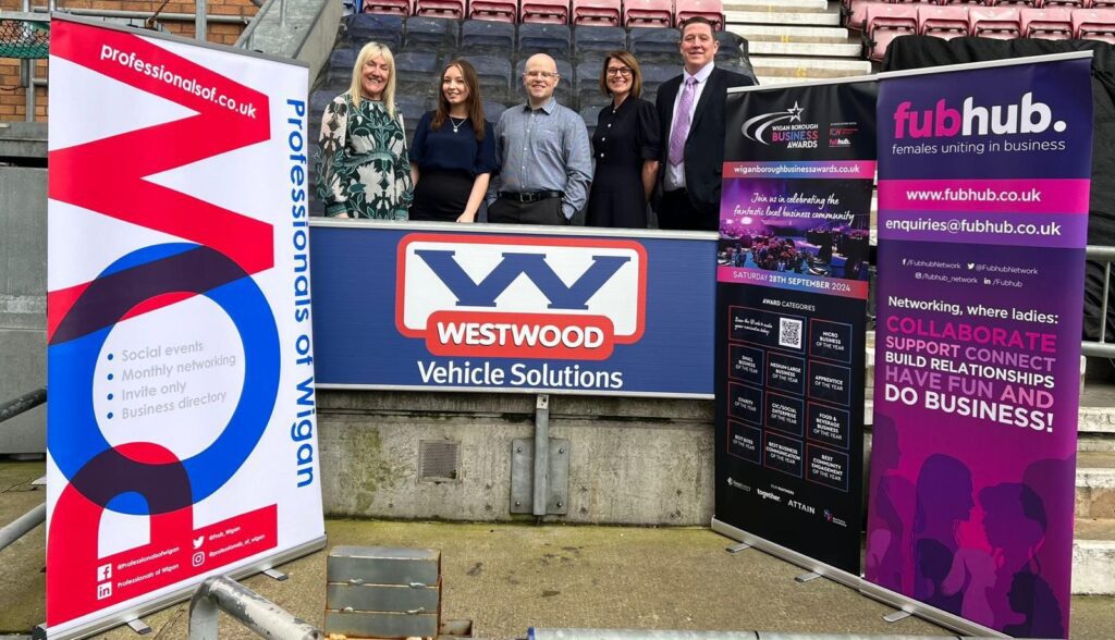 5 people behind westwood vehicle solutions banner